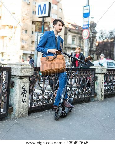 Bucharest, Romania, - Octomber 26, 2017: Using Electric Scooter On The Street On A Sunny Day With Sa