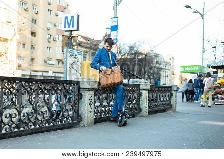 Bucharest, Romania, - Octomber 26, 2017: Using Electric Scooter On The Street On A Sunny Day With Sa