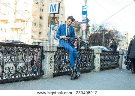 Bucharest, Romania, - Octomber 26, 2017: Using Electric Scooter On The Street On A Sunny Day With Sa