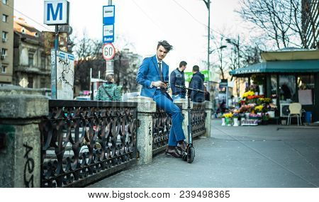 Bucharest, Romania, - Octomber 26, 2017: Using Electric Scooter On The Street On A Sunny Day With Sa