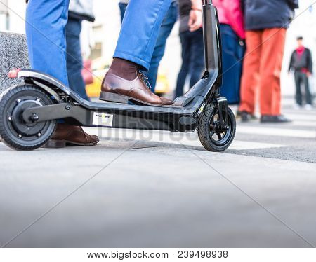 Bucharest, Romania, - Octomber 26, 2017: Using Electric Scooter On The Street On A Sunny Day With Sa