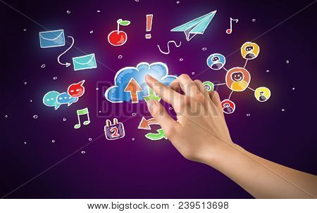 Female hand toucing mixed media icons with purple background
