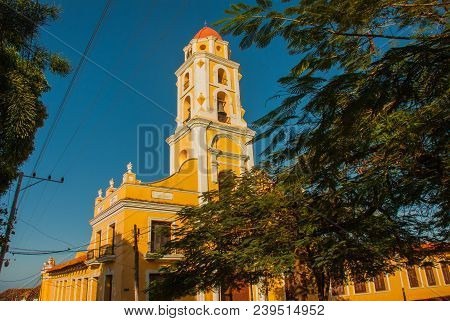 Trinidad, Cuba. The Bell Tower Of San Francisco De Asis Against The Blue Sky.