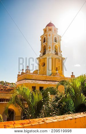 Trinidad, Cuba. The Bell Tower Of San Francisco De Asis Against The Blue Sky.