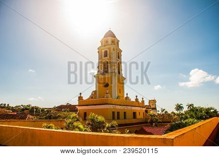 Trinidad, Cuba. The Bell Tower Of San Francisco De Asis Against The Blue Sky.