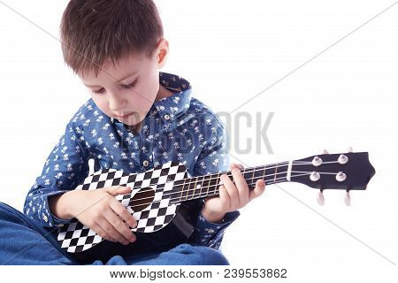 Boy Playing Ukulele Isolated On White. Isolated On White.