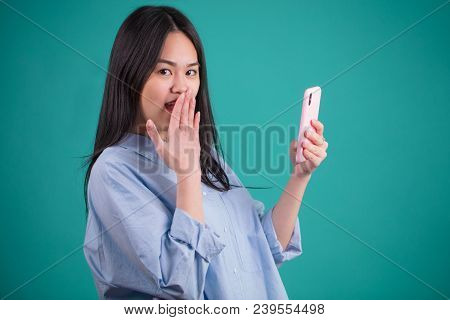 Portrait Of Surprised Anxious Asian Woman Expressing Shock, Fear Or Amasement