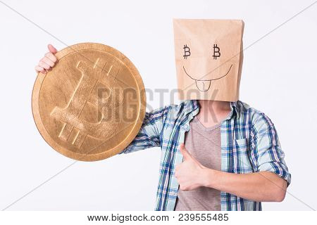 Golden Bitcoin In A Man Hand, Digitall Symbol Of A New Virtual Currency