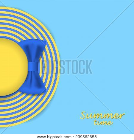 Summer Striped Hat With A Blue Bow. Woman Beach Sunhat On A Blue Background. Top View. Summer Concep