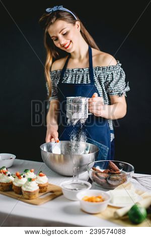Confectioner Young Blogger Giving Lesson Of Baking Cake Sifting Flour To The Bowl.