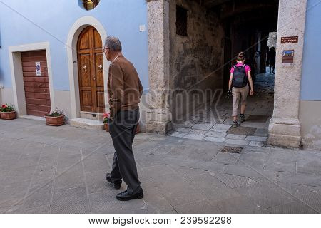 Asciano, Tuscany, Italy - Unknown Man Walks In The City Streets