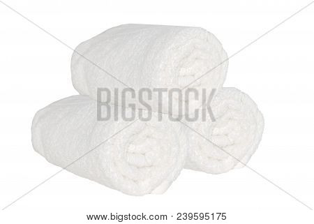 Three Clean Spa Towels Rolls On The White Isolated Backgtound