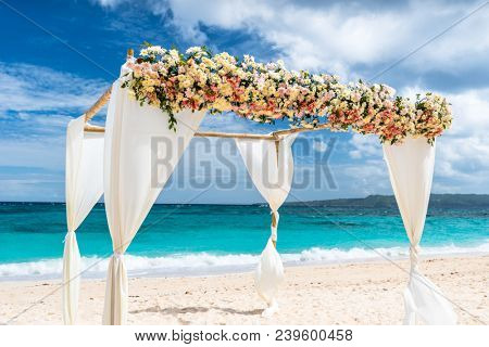decorated wedding arch on Puka beach at Boracay island Philippines