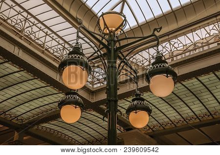 Brussels, Central Belgium - July 04, 2017. Art Nouveau Lamp And Glass Ceiling In An Old Building, At
