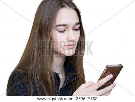 Horizontal Portrait Of Young Sad Serious Beautiful Girl With Long Blonde Hair With A Smartphone. Tee