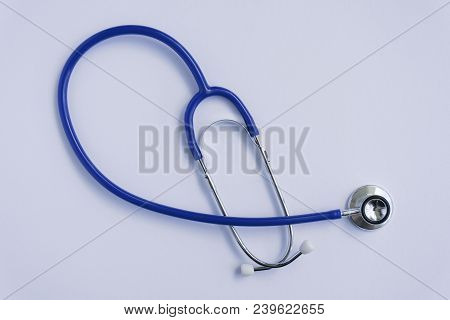 Stethoscope Lying On Top Of White Background