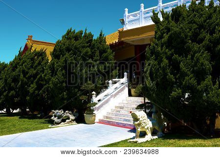 May 6, 2018 In Hacienda Heights, Ca:  Manicured Plants Surrounding A Staircase And Courtyard Beside 