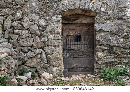 Very Old Weathered Brown Door Made Of Wood, Stone House (island Cres, Croatia)