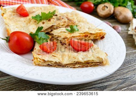 Pie, Casserole Pita With Mushrooms, Cottage Cheese And Cheese On A White Plate On A Wooden Backgroun