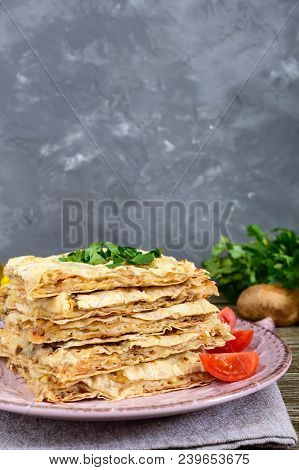 Pie, Casserole Pita With Mushrooms, Cottage Cheese And Cheese On A Plate On A Wooden Background. Lay