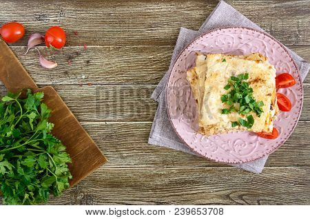 Pie, Casserole Pita With Mushrooms, Cottage Cheese And Cheese On A Plate On A Wooden Background. Lay
