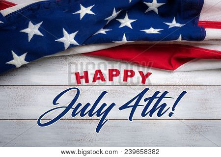 United States Flag On White, Weathered Clapboard Background With July 4th Greeting