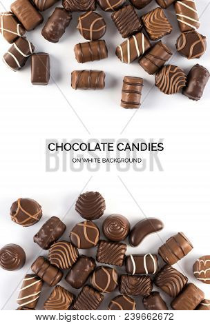 Beautiful Creative Chocolate Sweets Isolated On White Background. Scattered Chocolates Top View And 