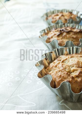 Home-baked Cakes On The Kitchen Table In The Baking Dish