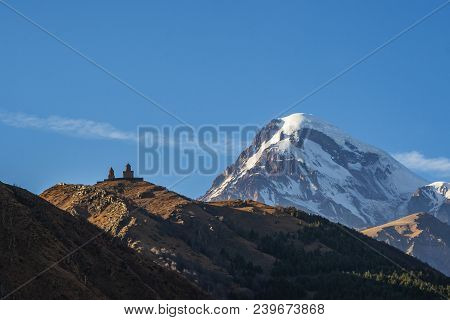 Holy Trinity Church Near The Village Of Gergeti In Georgia
