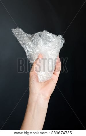Plastic Bubble Wrap Polyethylene Package Material In Hand. Recycling, Electricity, Environment And E