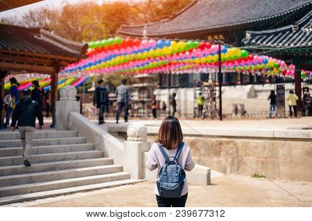 Young Asian Traveler Traveling Into Bongeunsa Temple In The Gangnam District Of Seoul, South Korea.