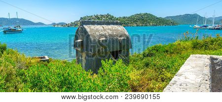 Panorama Of The Coast Of Kekova Bay With Ancient Lycian Tomb In Lush Greenery Of Preserved Necropoli