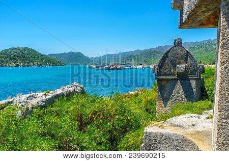 The Ancient Lycian Necropolis With Sarcophagi Among The Lush Greenery On Rocky Coast Of Ucagiz Villa