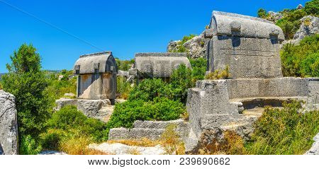 The Carved Stone Sarcophagi Of The Lycian Necropolis, Located On The Rocky Hill In Ucagiz, Kekova, T
