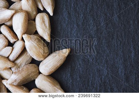 Shelled Sunflower Seeds (kernels Only) On Black Rustic Background. Top View With Copy Space
