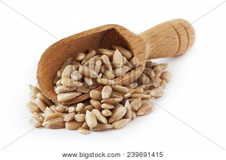 Shelled Sunflower Seeds (kernels Only) With Wooden Scoop Isolated On White Background