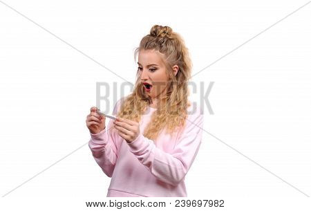 Upset, Sad Woman Looking A Positive Pregnancy Test.