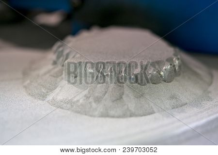 Object Printed On Metal 3d Printer, Laser Sintering Machine For Metal Close-up. A Metal Object Sprin
