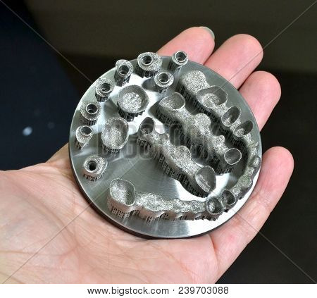 Object Printed On Metal 3d Printer Isolated. Dental Crowns Created In A Laser Sintering Machine Clos