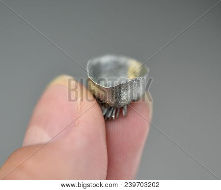 Small Object Printed On Metal 3d Printer Macro. Dental Crowns Created In Laser Sintering Machine Clo
