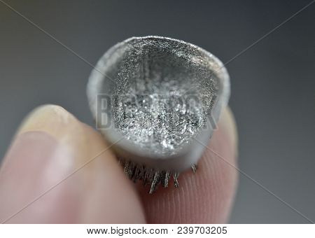 Small Object Printed On Metal 3d Printer Macro. Dental Crowns Created In Laser Sintering Machine Clo