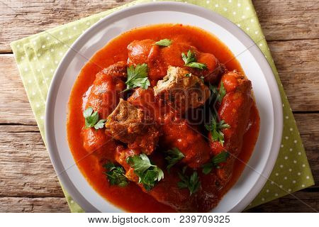Delicious Beef Steak Stuffed With Parsley And Parmesan Cheese Stewed In Tomato Sauce Close-up. Horiz