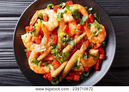Fried Prawns With Pepper, Garlic, Corn Cob And Herbs Close-up. Horizontal Top View
