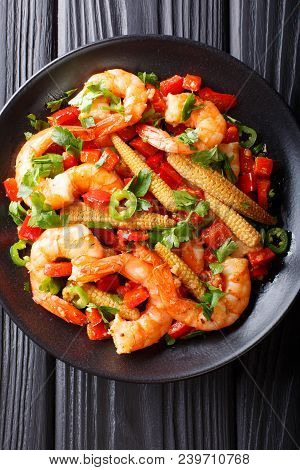 Fried Prawns With Pepper, Garlic, Corn Cob And Herbs Close-up. Vertical Top View