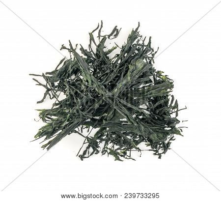 Heap Of Dry Wakame Seaweed Isolated On White Background. Healthy Algae Food