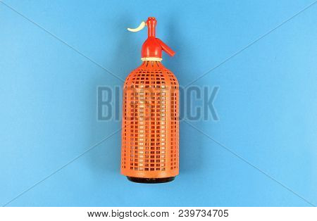 Detail Of A Siphon Bottle On Blue