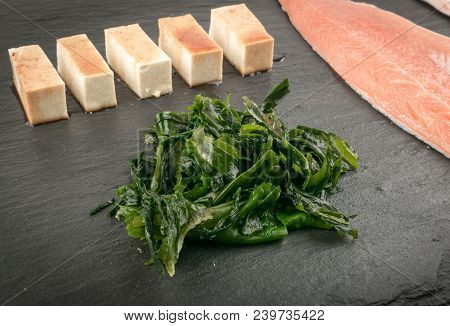 Wakame Seaweed On Natural Stone Background. Healthy Algae Food With Soy Sauce And Tofu