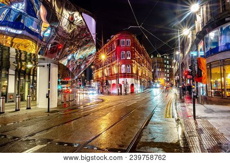 Birmingham, Uk. Night Life In The Center Of Birmingham, Uk. Dark Black Sky With Illuminated Building