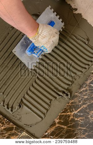 Close-up Of A Master's Hand That Makes Furrows In A Glutinous Solution