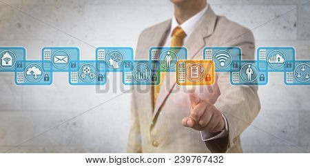Unrecognizable Corporate Executive Choosing Block In Blockchain. It Concept For Data Management Via 
